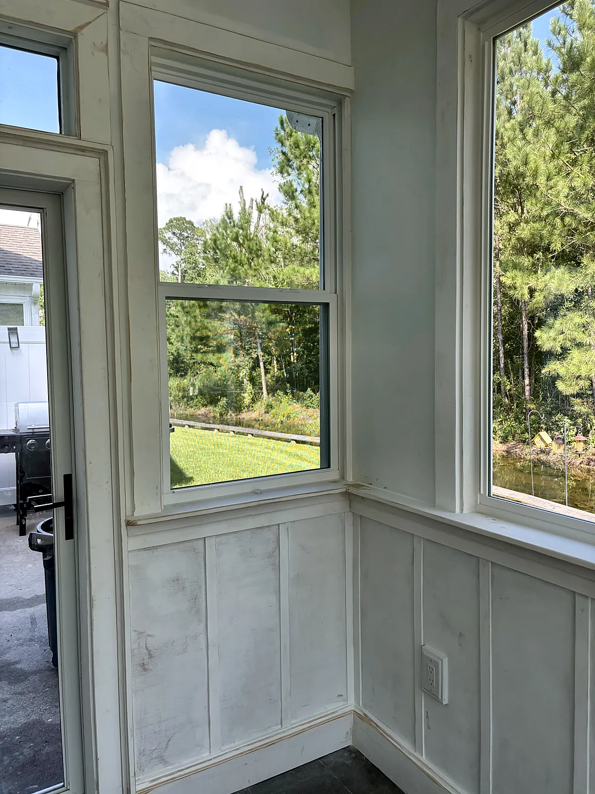 Sunroom door and windows with wainscot