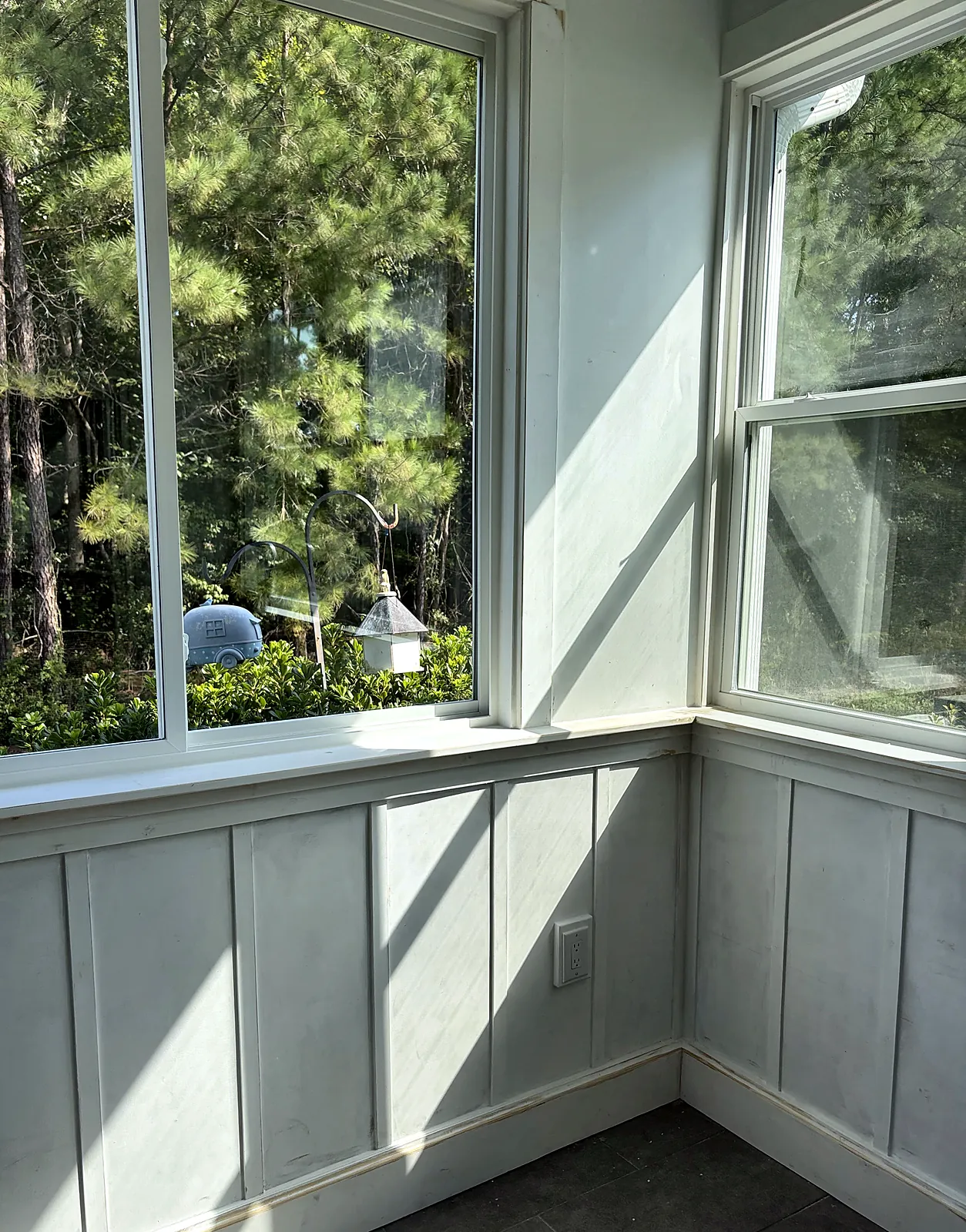 Board-and-batten sunroom with double-hung windows