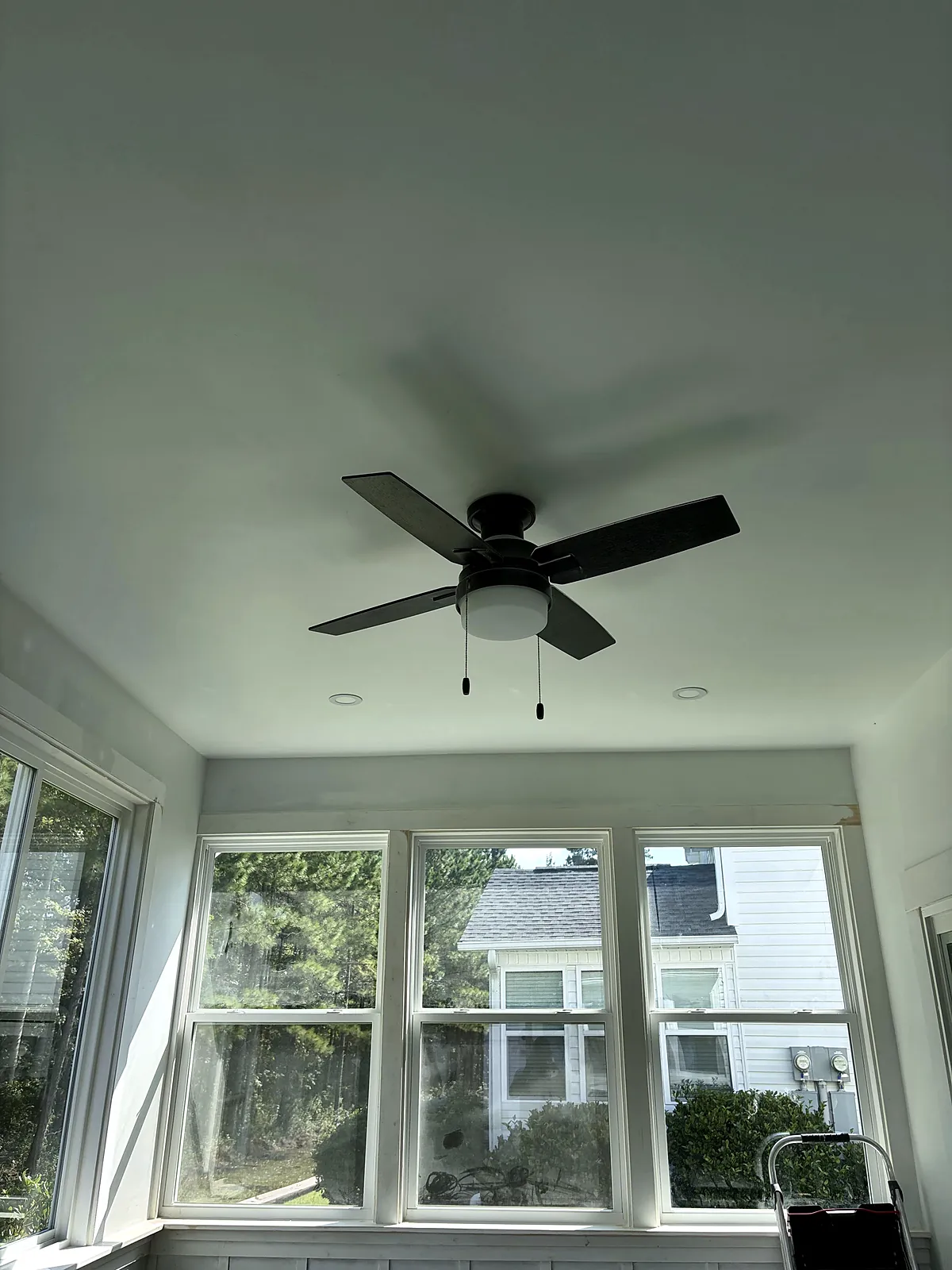 Sunroom ceiling fan and window wall