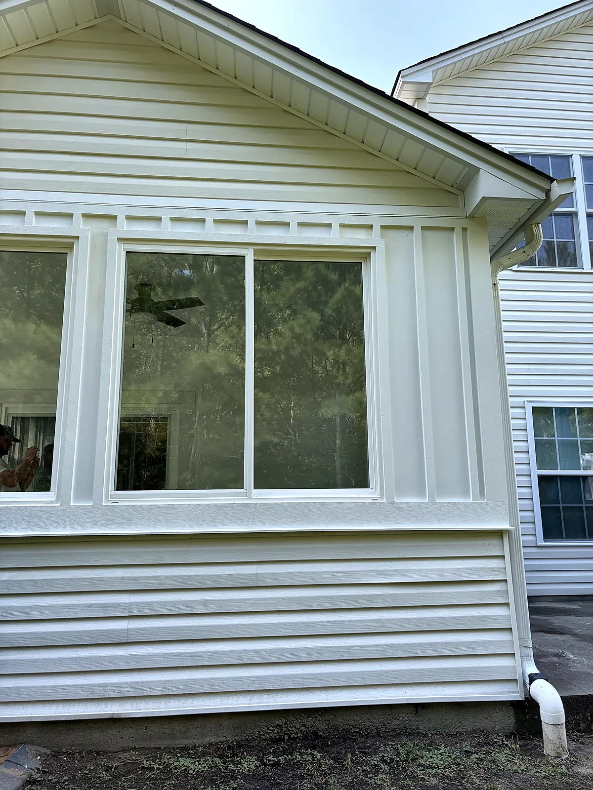 Sunroom exterior with siding and trim