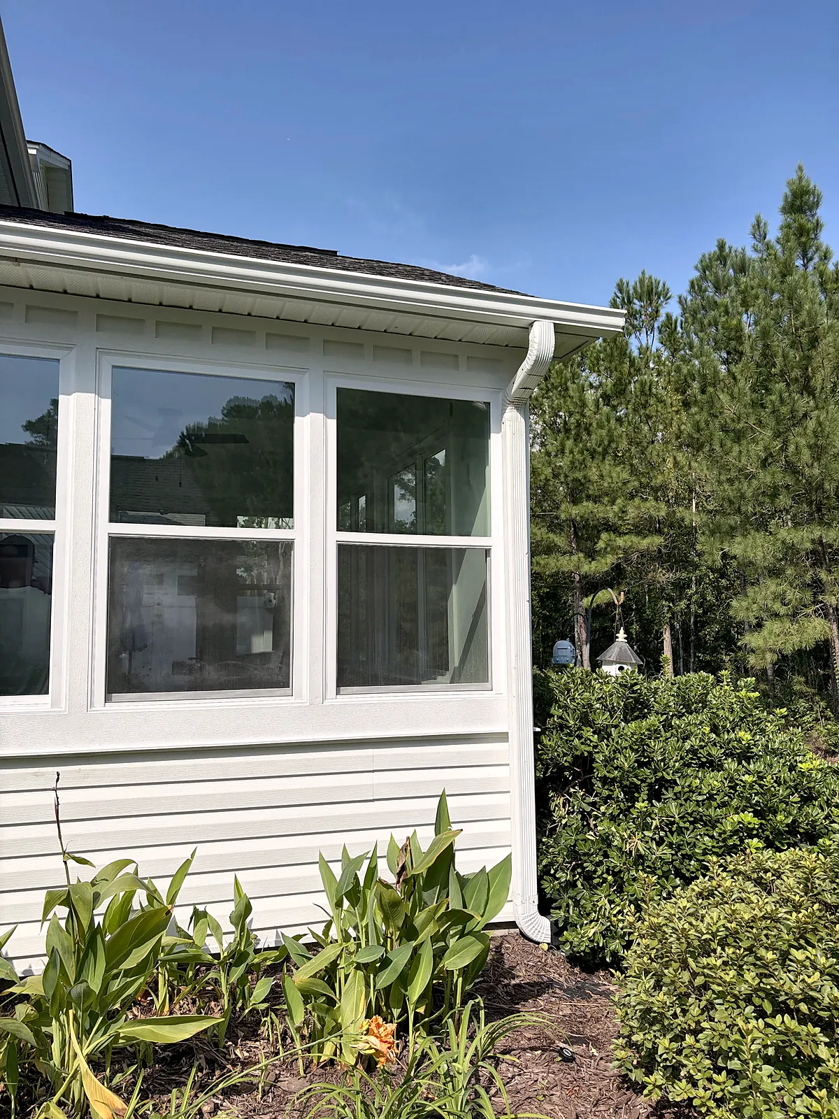 Sunroom exterior corner against blue sky