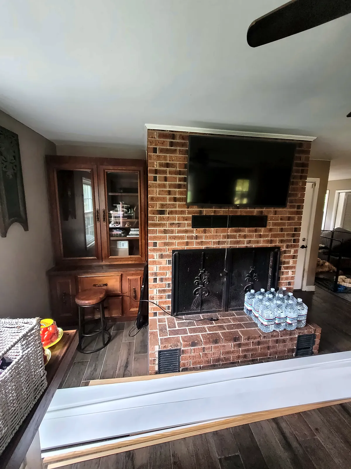 Red brick fireplace before makeover