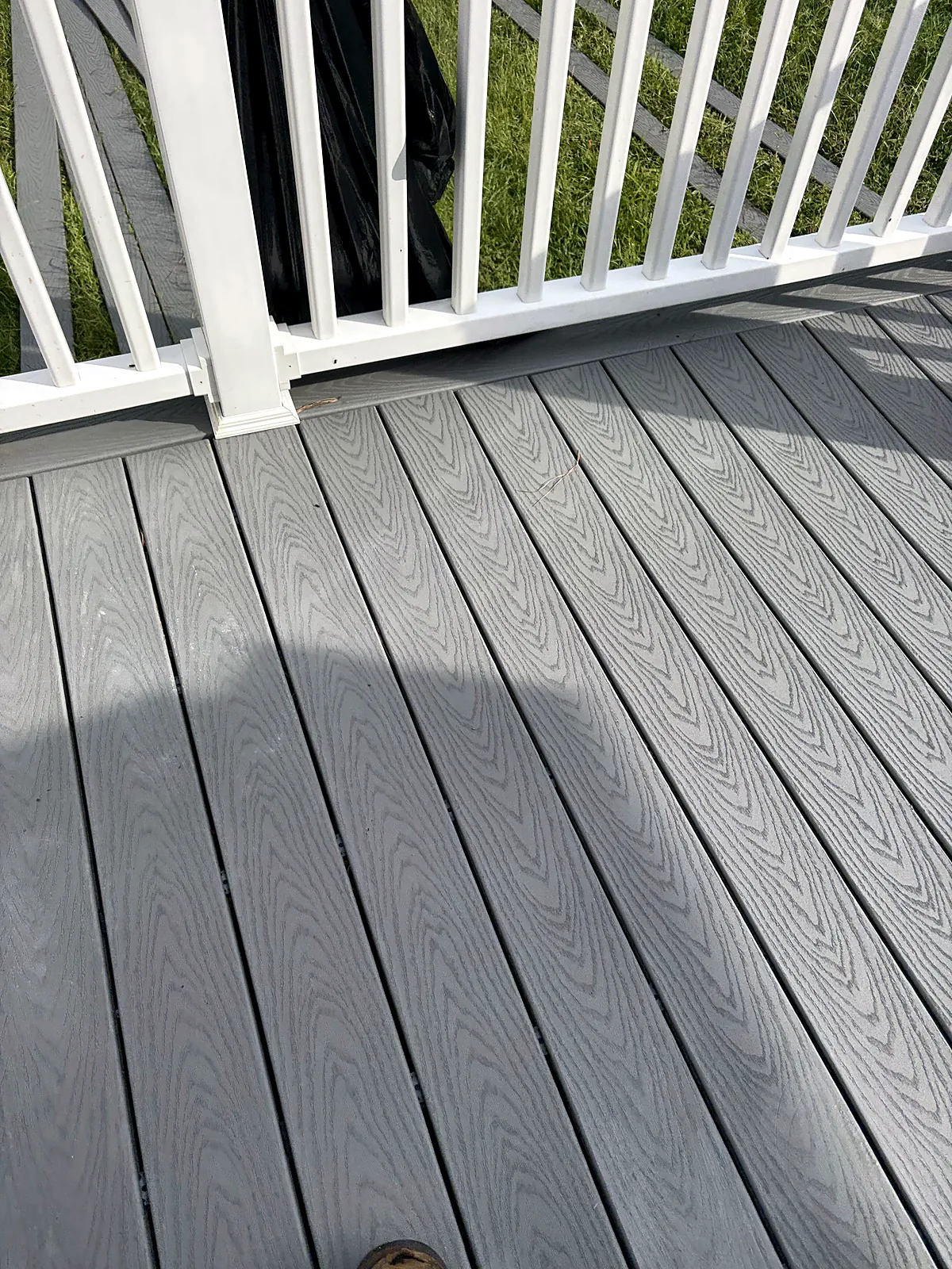 Grey composite deck with white railings