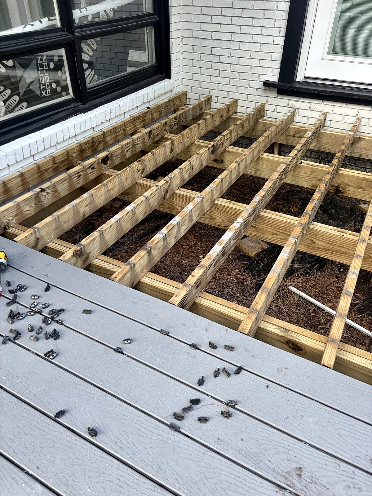 Pressure-treated deck framing before decking