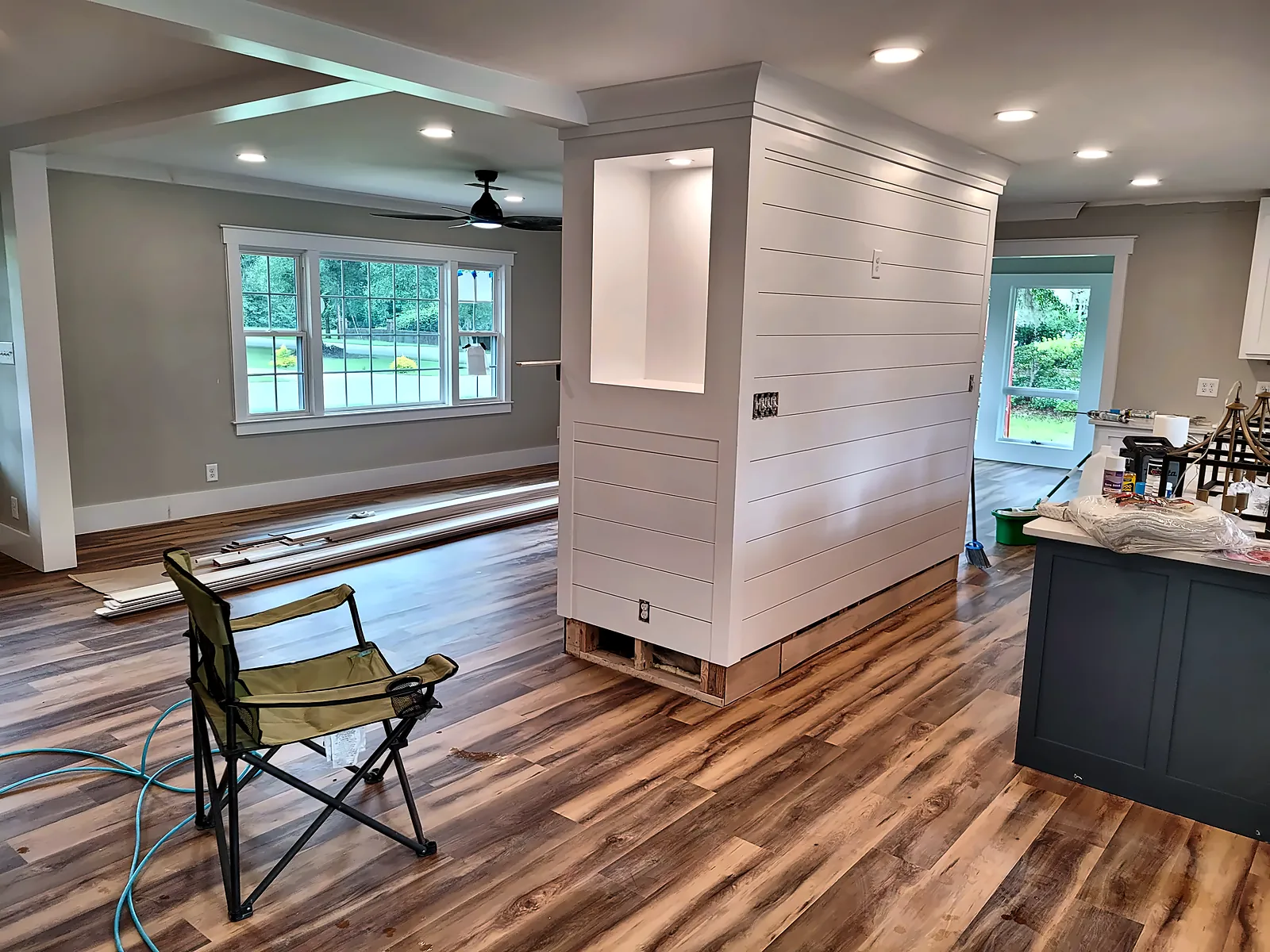 Open living space with shiplap wall and kitchen island