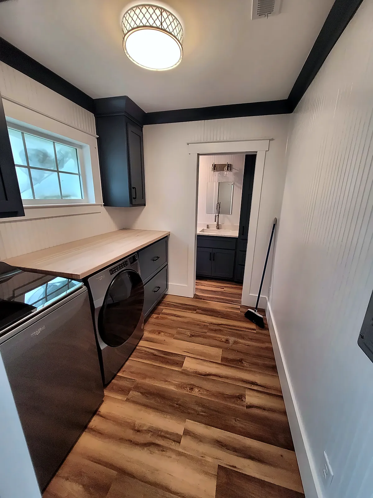 Laundry room with front-load washer, dryer and butcher-block counter