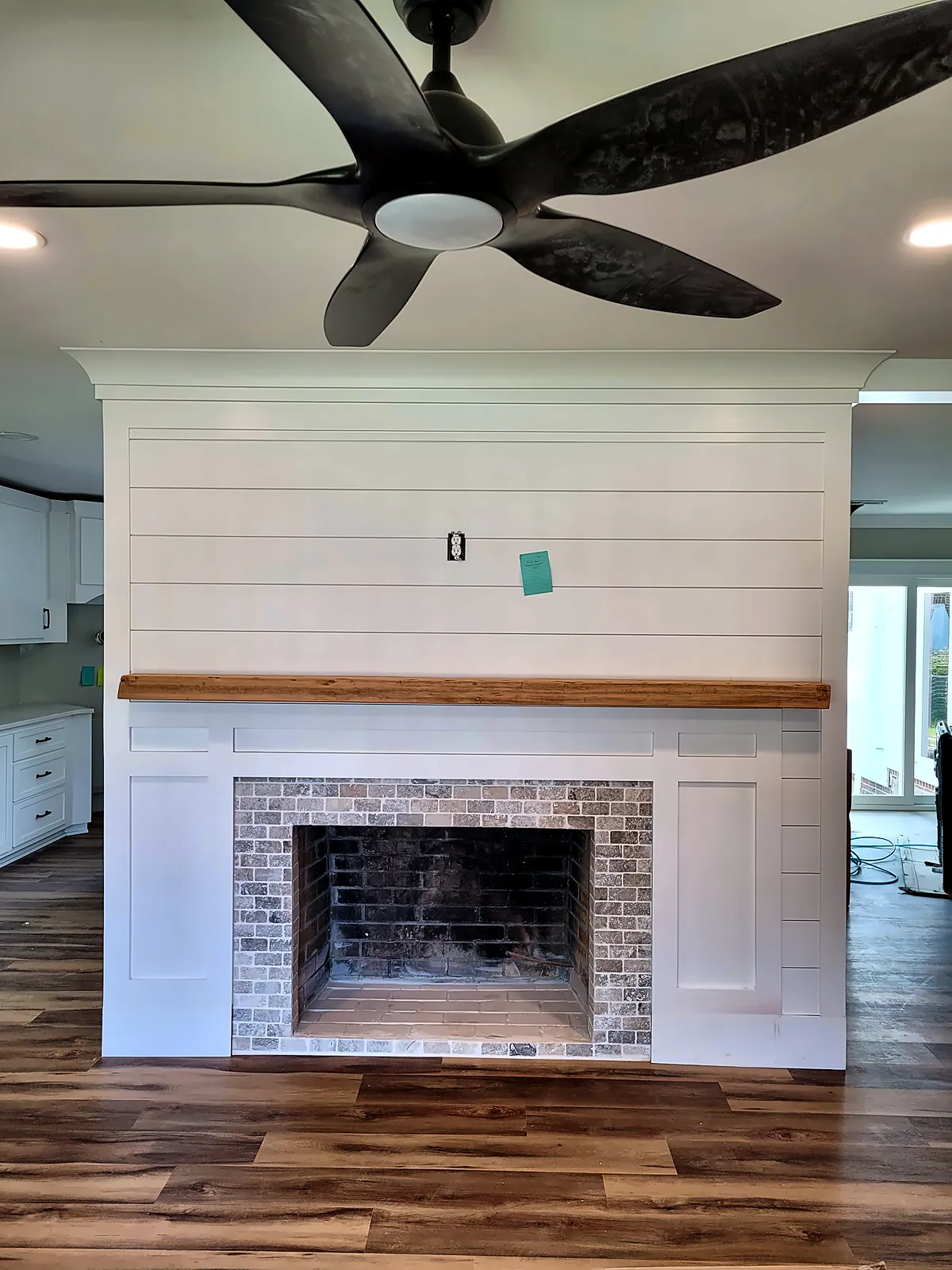 White shiplap fireplace with wood mantel